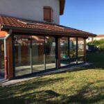 phto d'un pavillon avec une terrasse fermée par des coulissants .Réalisation Rémy Ferere St marcellin 38